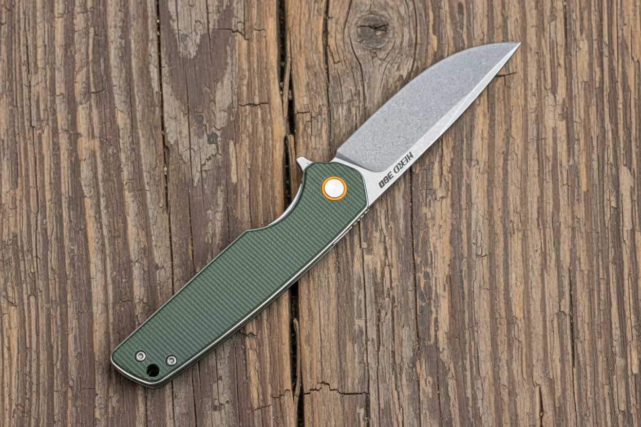 Folding knife with a green handle