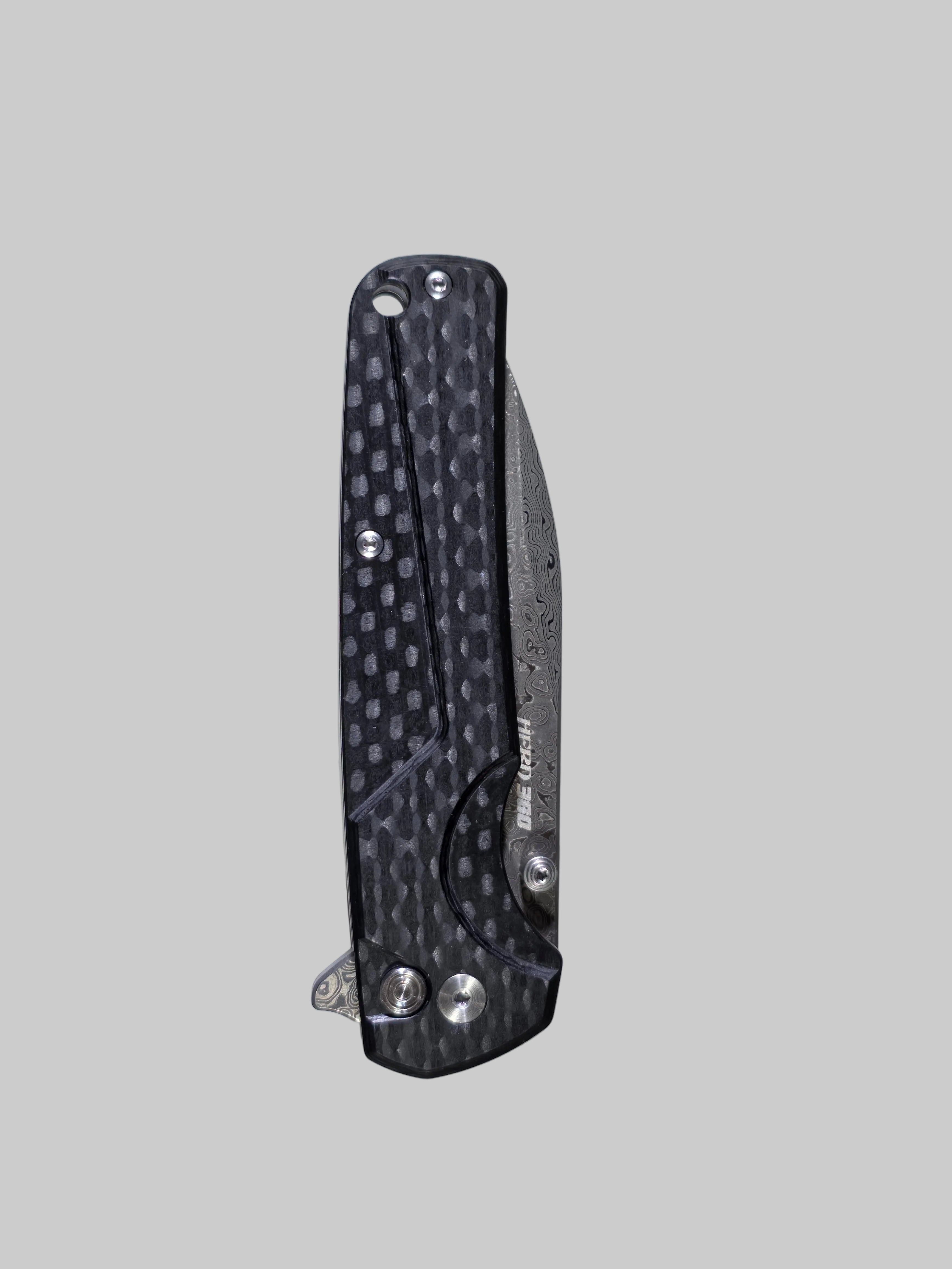 Folding knife with textured handle on a light gray background