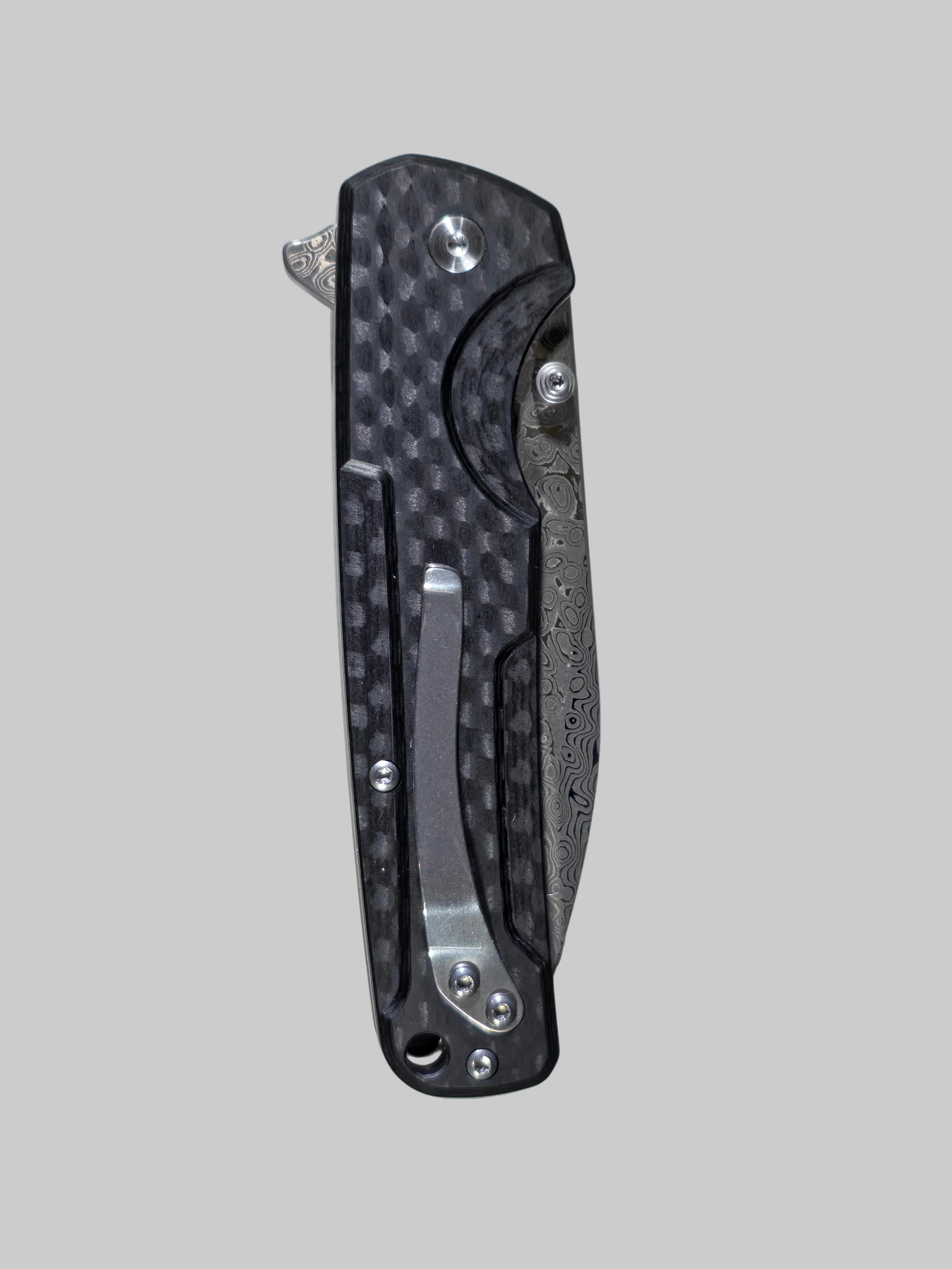 Carbon fiber folding knife on a white background