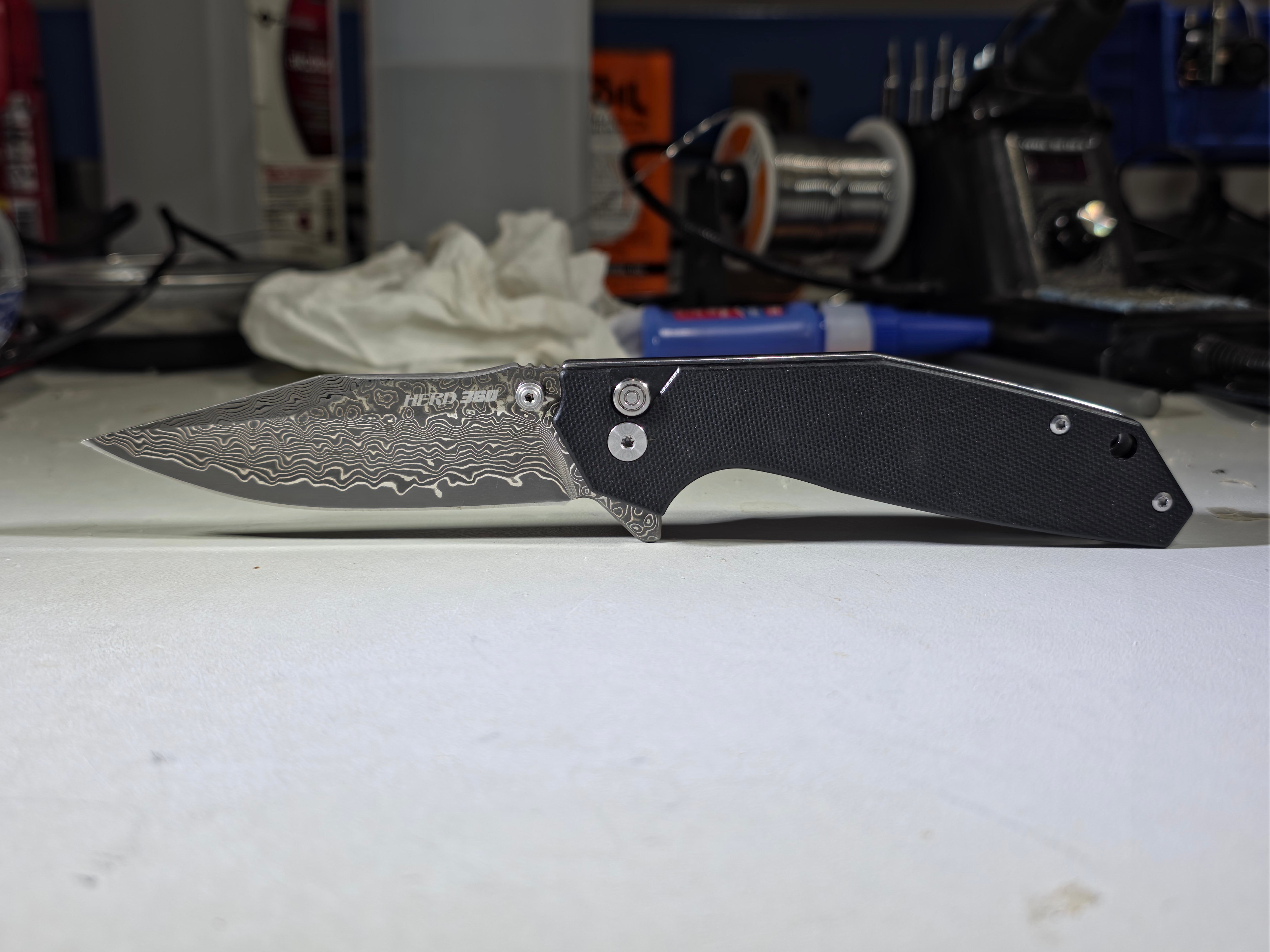 BL16-D Damascus Button Lock