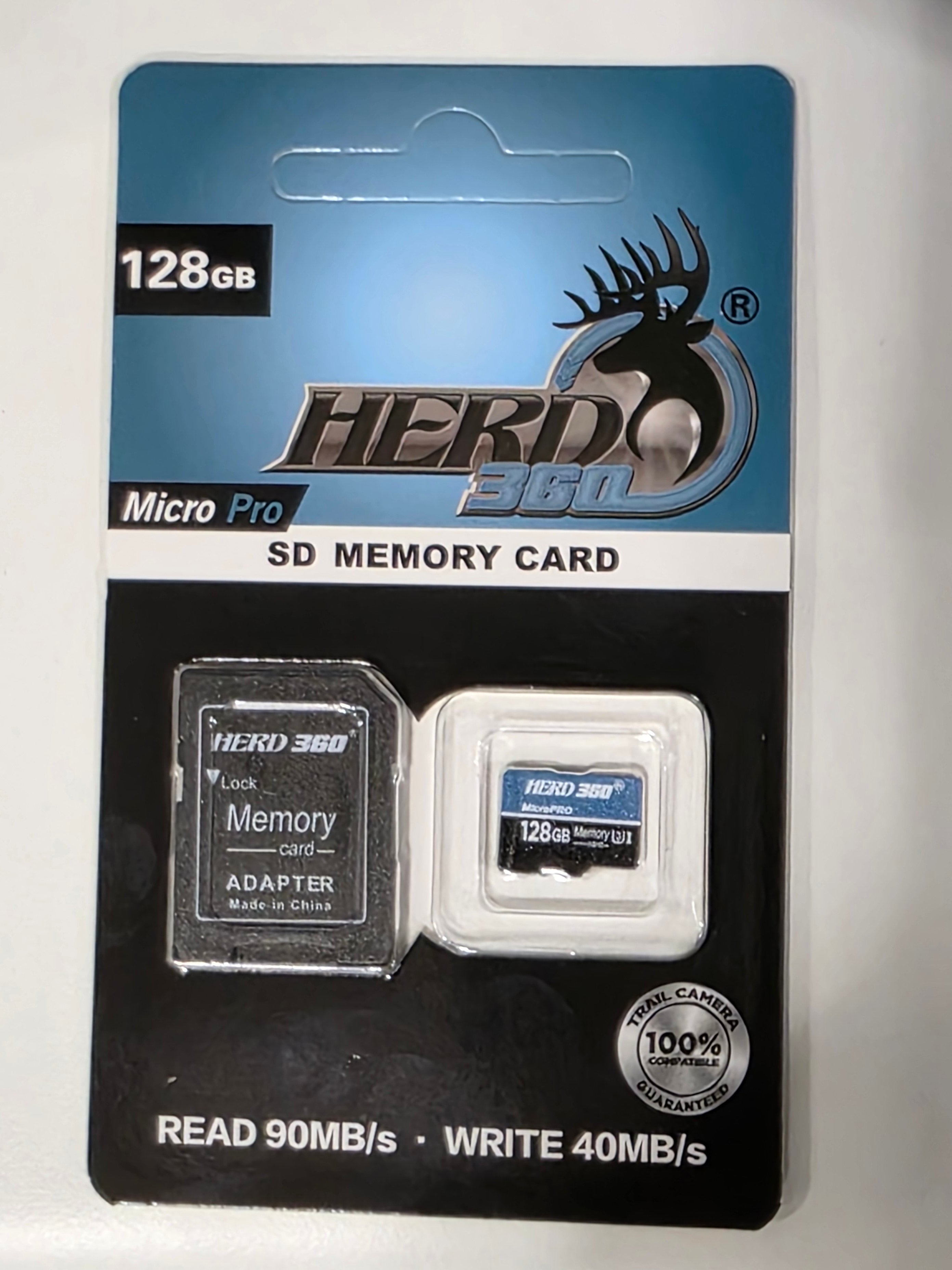 A 128GB Herd360 Micro Pro SD Memory Card with its black adapter and retail blister packaging, resting on a white surface.